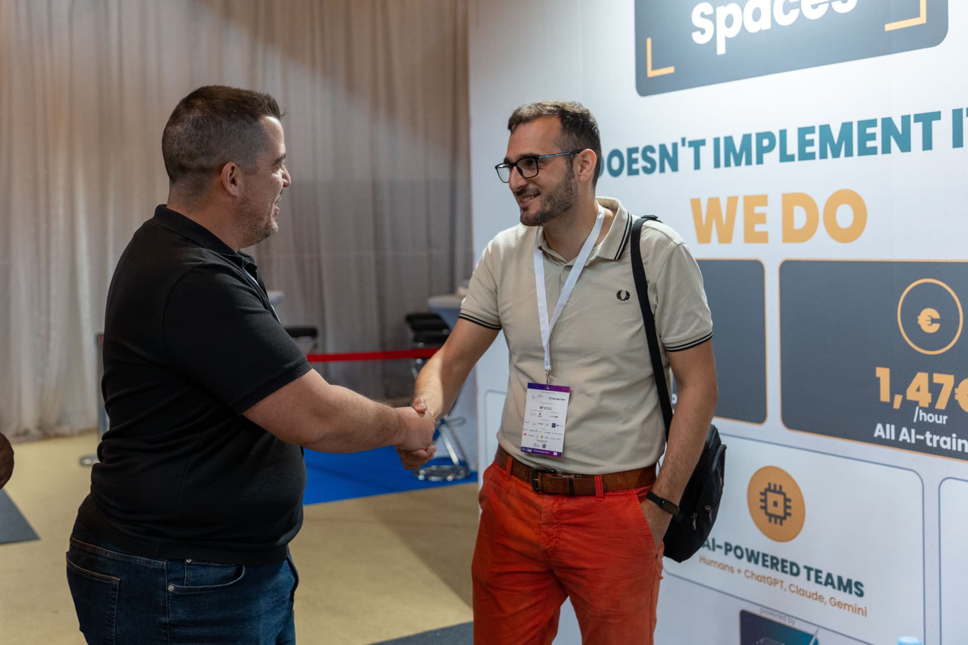 Two professionals connecting on the exhibition floor